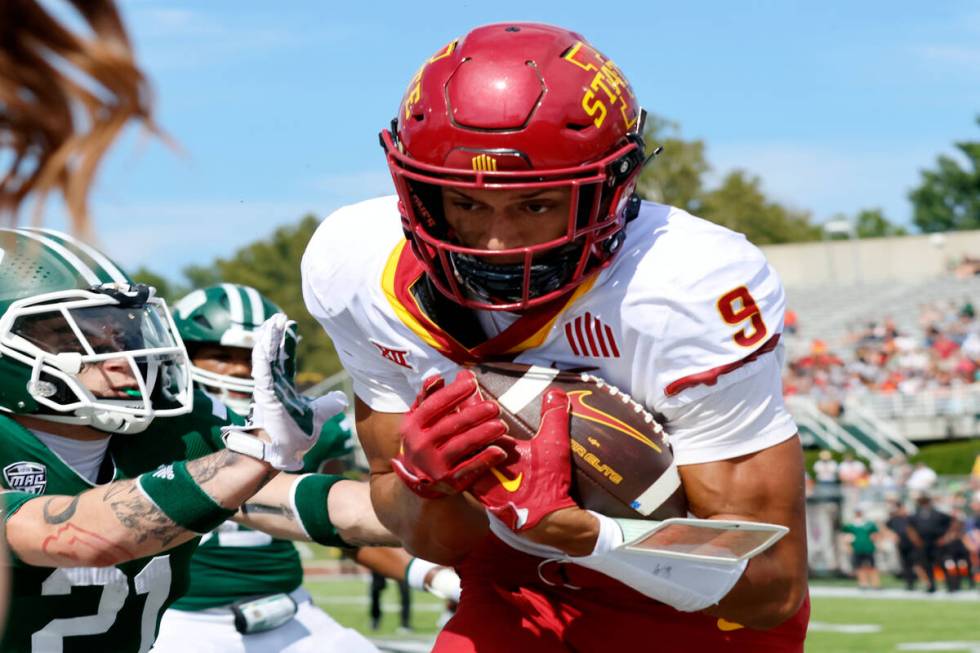 Iowa State wide receiver Jayden Higgins, right, makes a touchdown catch against Ohio defensive ...