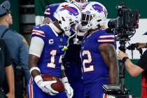 Buffalo Bills wide receiver Stefon Diggs (14) celebrates with Buffalo Bills running back Damien ...