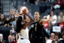 Las Vegas Aces center Kiah Stokes (41) guards Chicago Sky guard Dana Evans (11) during the firs ...