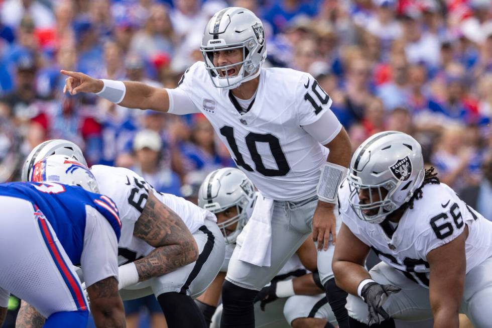 Las Vegas Raiders quarterback Jimmy Garoppolo (10) signals during an NFL football game, Sunday, ...