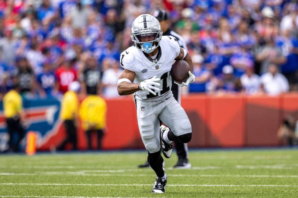 Las Vegas Raiders wide receiver Tre Tucker (11) runs after catch during an NFL football game, S ...