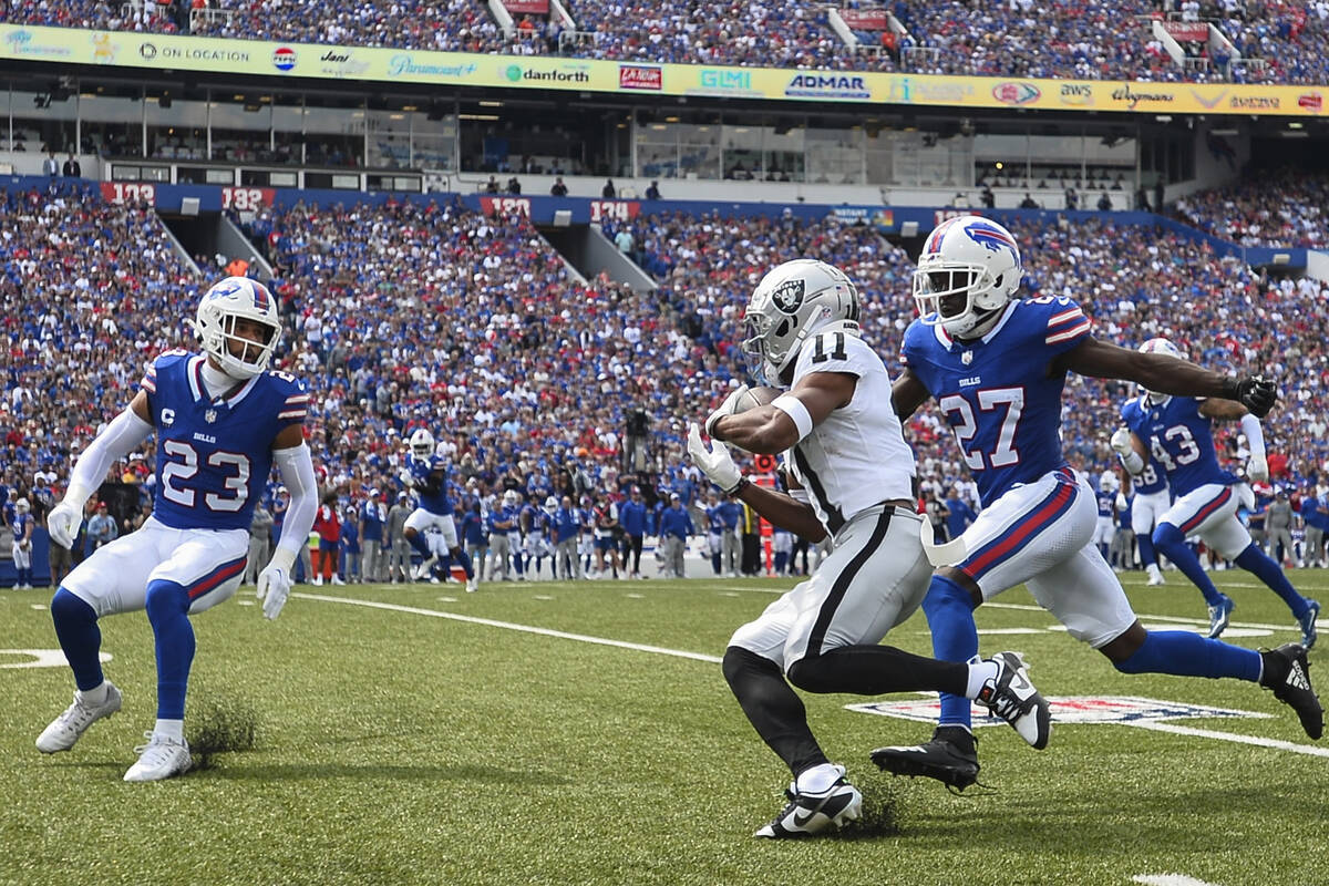 Buffalo Bills' Tre'Davious White (27) and Micah Hyde (23) chase Las Vegas Raiders' Tre Tucker ( ...