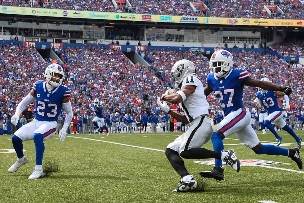 Buffalo Bills' Tre'Davious White (27) and Micah Hyde (23) chase Las Vegas Raiders' Tre Tucker ( ...