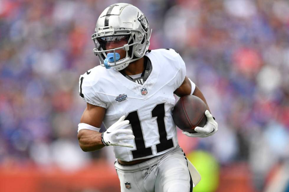 Las Vegas Raiders wide receiver Tre Tucker (11) runs during the first half of an NFL football g ...