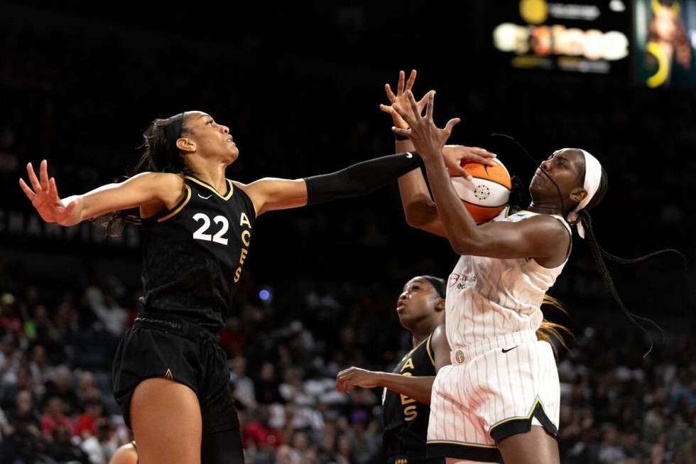 Las Vegas Aces forward A'ja Wilson (22) swats down a shot by Chicago Sky center Elizabeth Willi ...