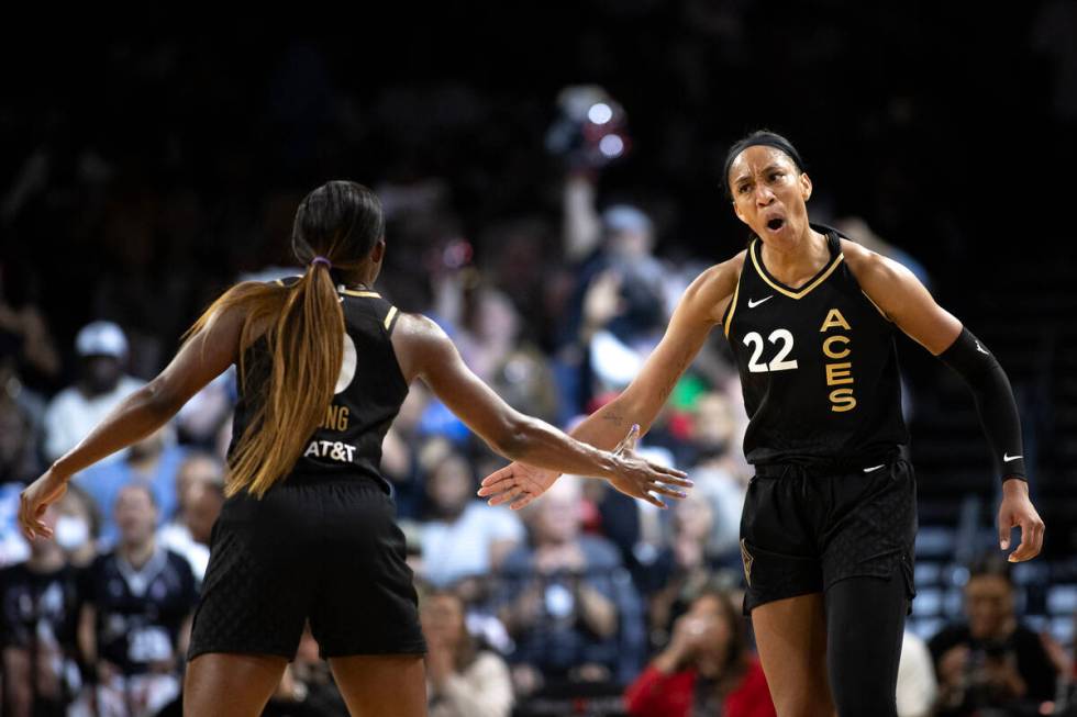 Las Vegas Aces forward A'ja Wilson (22) celebrates with guard Jackie Young (0) after scoring du ...