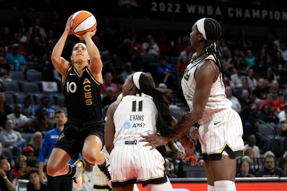 Las Vegas Aces guard Kelsey Plum (10) jumps to shoot over Chicago Sky guard Dana Evans (11) whi ...