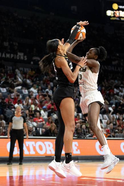 Las Vegas Aces forward A'ja Wilson (22) swats down a shot by Chicago Sky center Sika Kone (23) ...