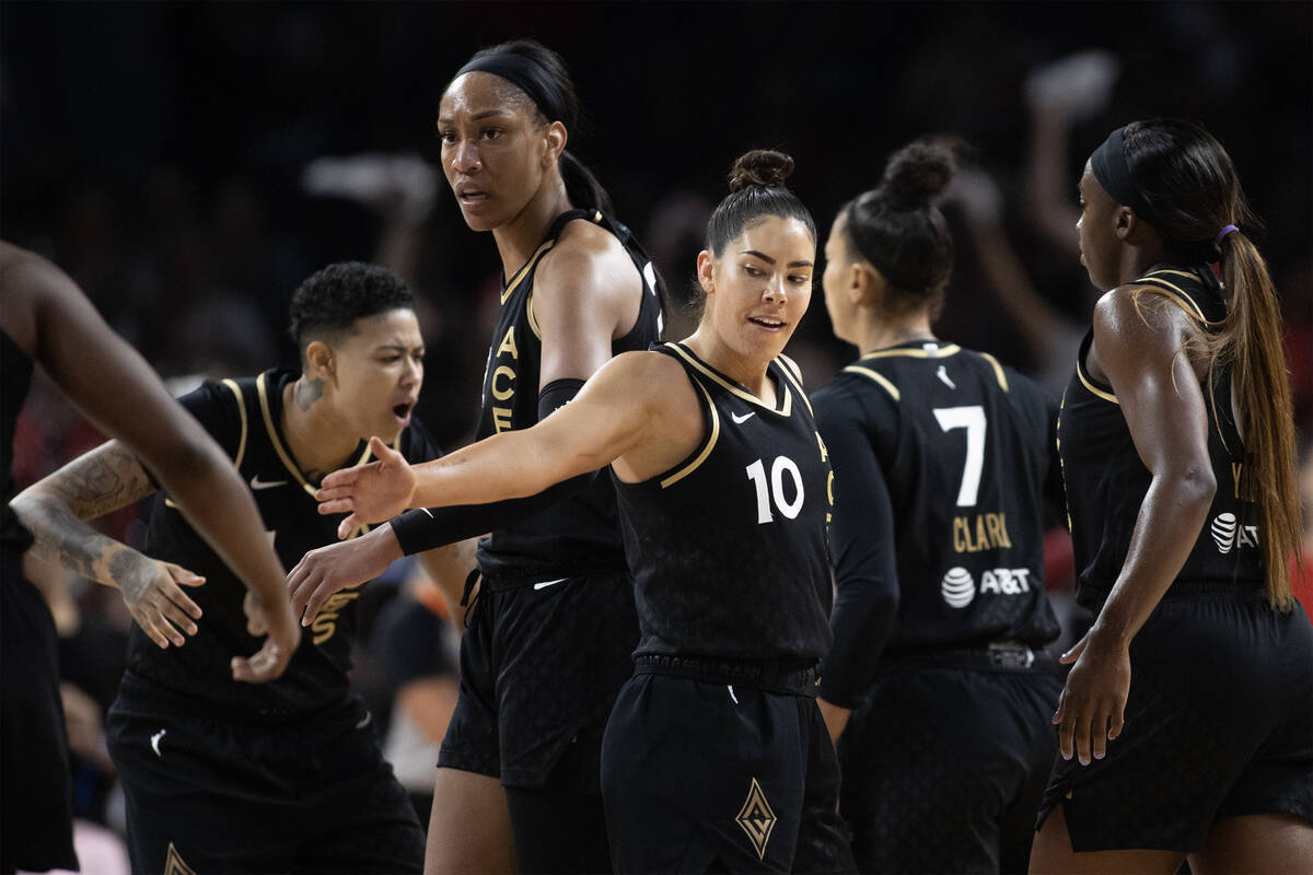Las Vegas Aces guard Kelsey Plum (10) and her teammates gather after the Chicago Sky called a t ...