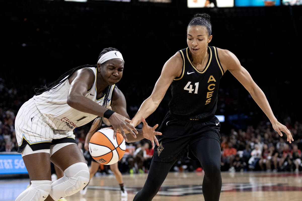 Las Vegas Aces center Kiah Stokes (41) attempts to steal the ball back from Chicago Sky center ...