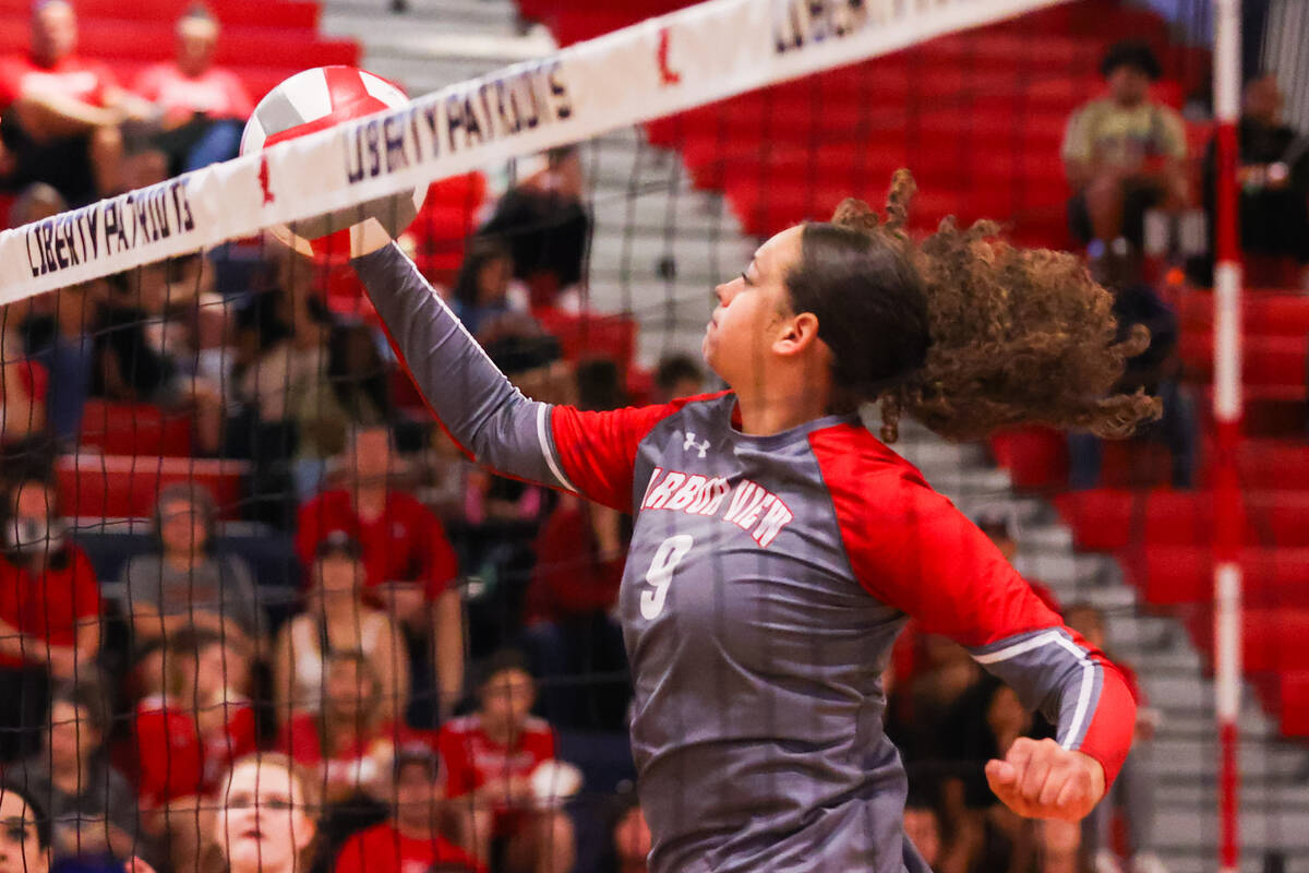 Arbor View’s Willow Watson (9) taps the ball over the net during a volleyball game betwe ...