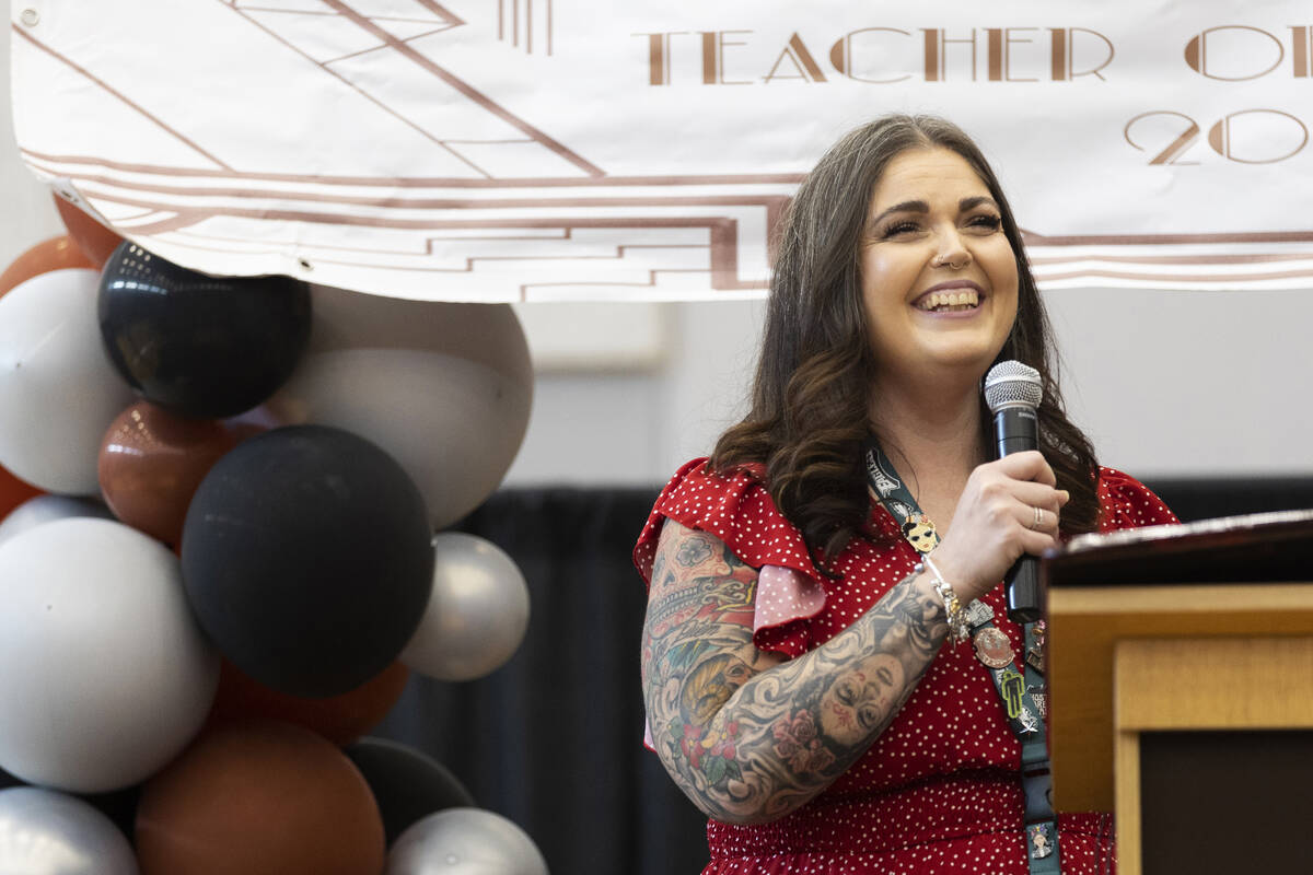 Laura Penrod, an english teacher at Southwest Career and Technical Academy, reacts after winnin ...