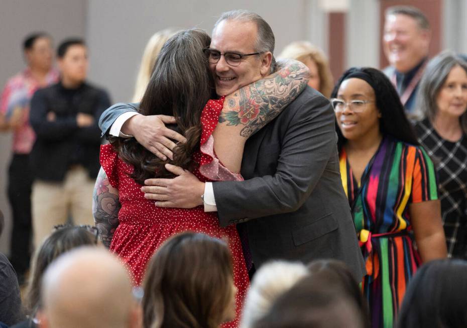 Laura Penrod, left, an english teacher at Southwest Career and Technical Academy, hugs Clark Co ...