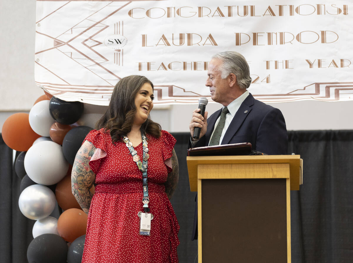 Governor Joe Lombardo, right, congratulates Laura Penrod, an english teacher at Southwest Caree ...