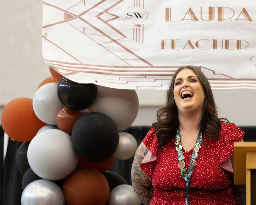 Laura Penrod, an english teacher at Southwest Career and Technical Academy, reacts after winnin ...