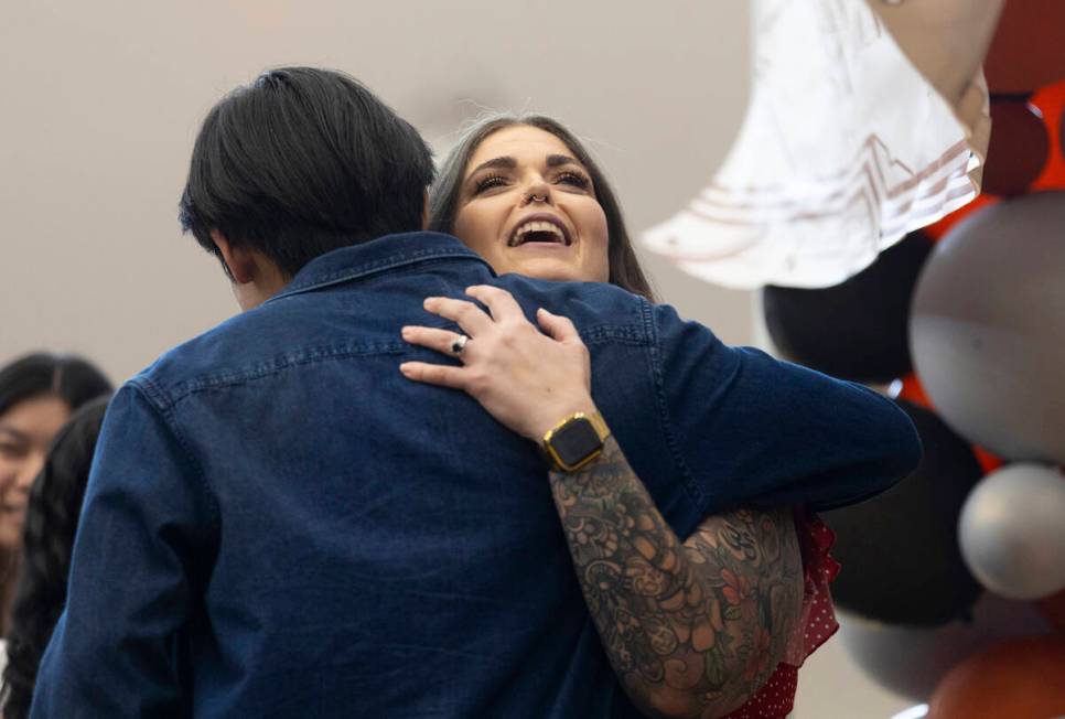 Laura Penrod, an english teacher at Southwest Career and Technical Academy, hugs a student afte ...