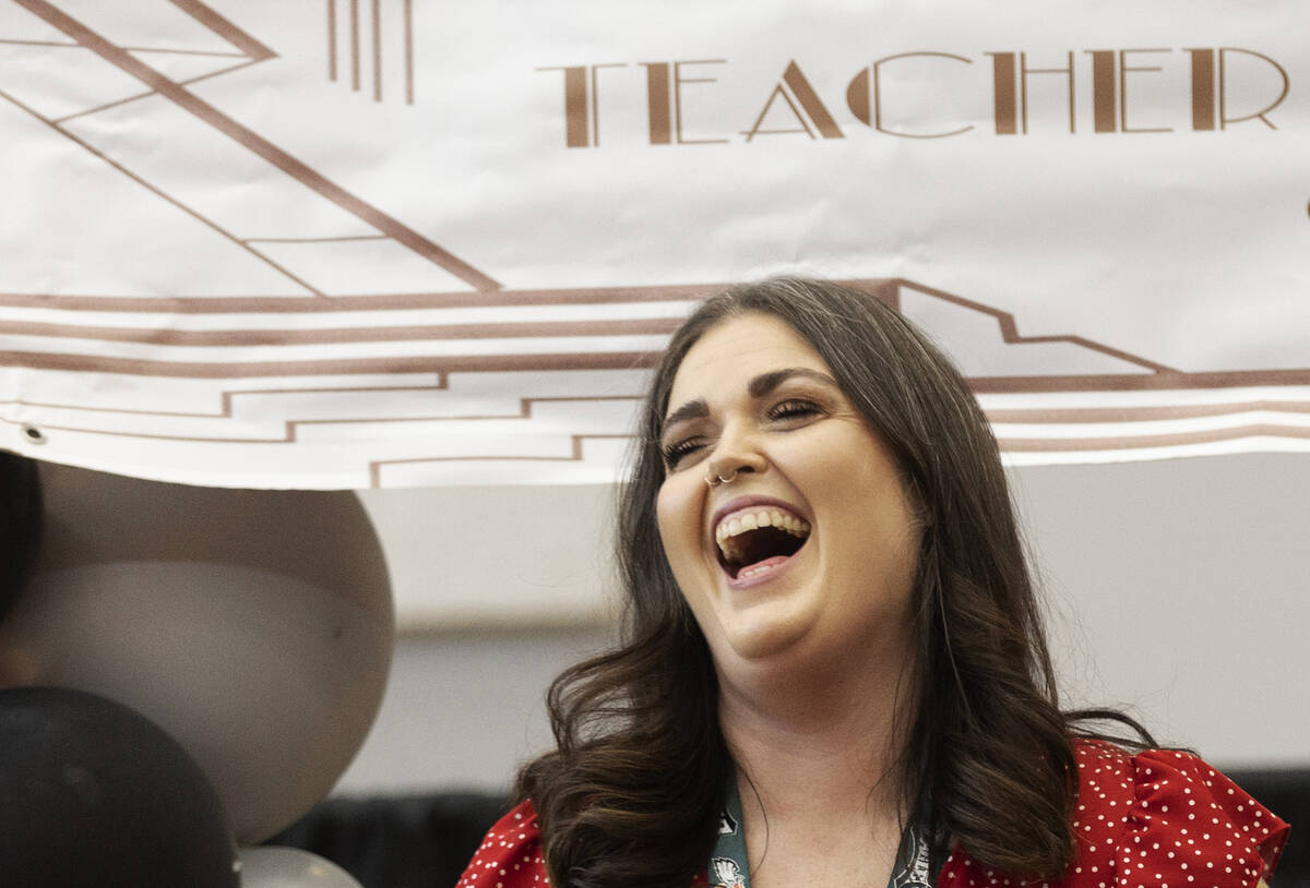 Laura Penrod, an english teacher at Southwest Career and Technical Academy, reacts after winnin ...