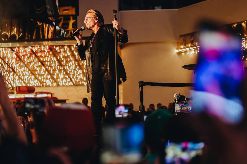 U2 performs while filming a music video in front of the Plaza hotel and casino on Sunday, Sept. ...
