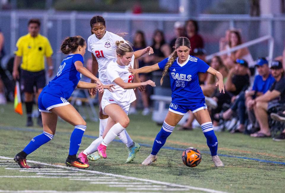 Coronado forward Aubrey Wagner (24) battles for the ball with Bishop Gorman (26) during the fir ...