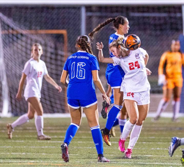 Coronado forward Aubrey Wagner (24) battles for a header with Bishop Gorman midfielder Robyn Di ...