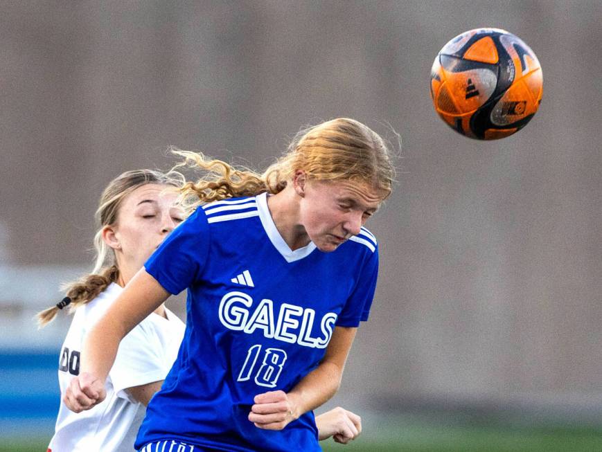 Bishop Gorman defender Grace Yager (18) heads the ball upfield against Coronado during the firs ...