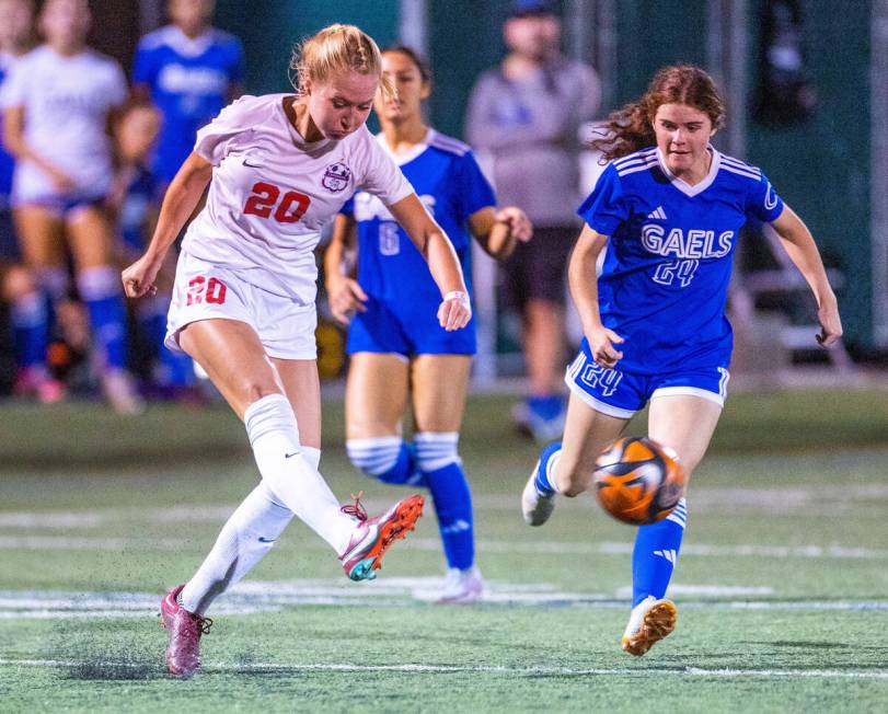 Coronado defender Cate Gusick (20) kicks the ball from Bishop Gorman forward Hunter Borgel (24) ...