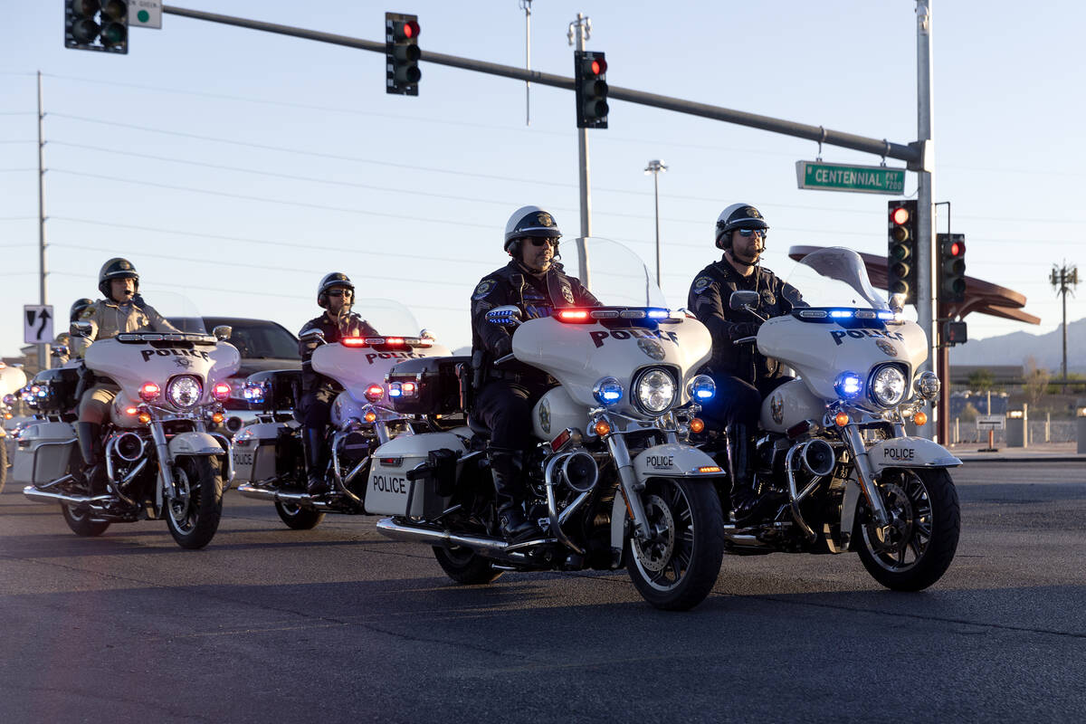 Motorcycle police officers arrive to a memorial for Andreas Probst, a cyclist who was killed in ...