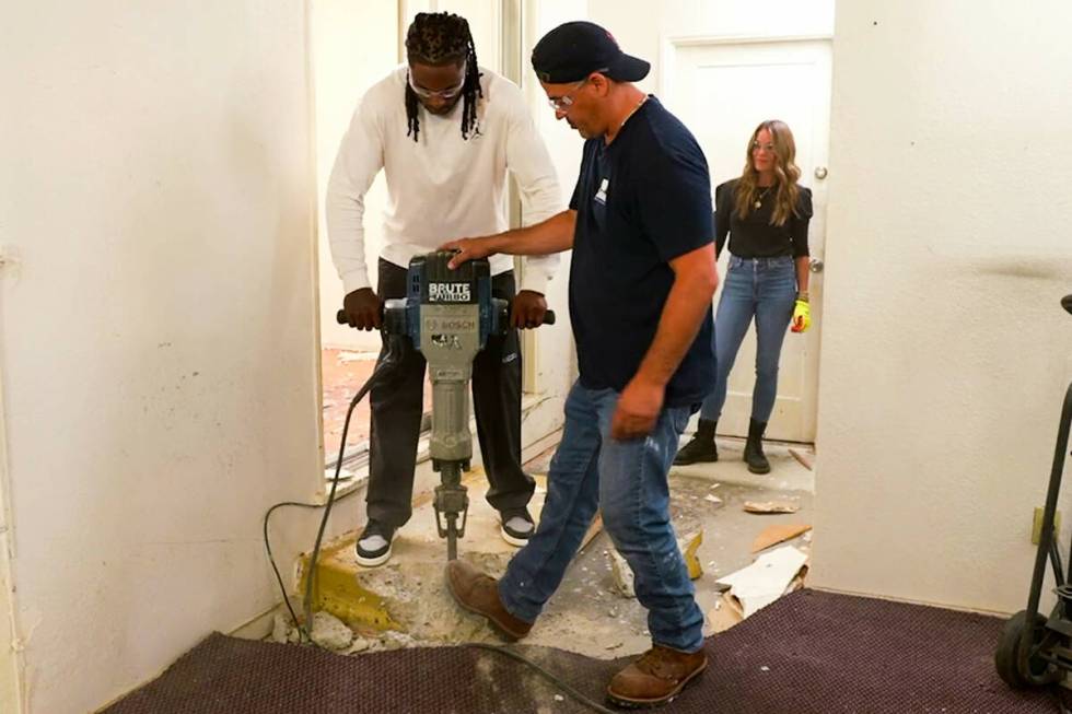 Raiders All-Pro wide receiver Davante Adams trades his football for a sledgehammer as he gifts ...