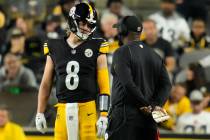 Pittsburgh Steelers quarterback Kenny Pickett (8) talks with head coach Mike Tomlin during an N ...
