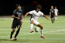 Coronado midfielder Dylan Flores (5) pivots with the ball before shooting while Palo Verde midf ...