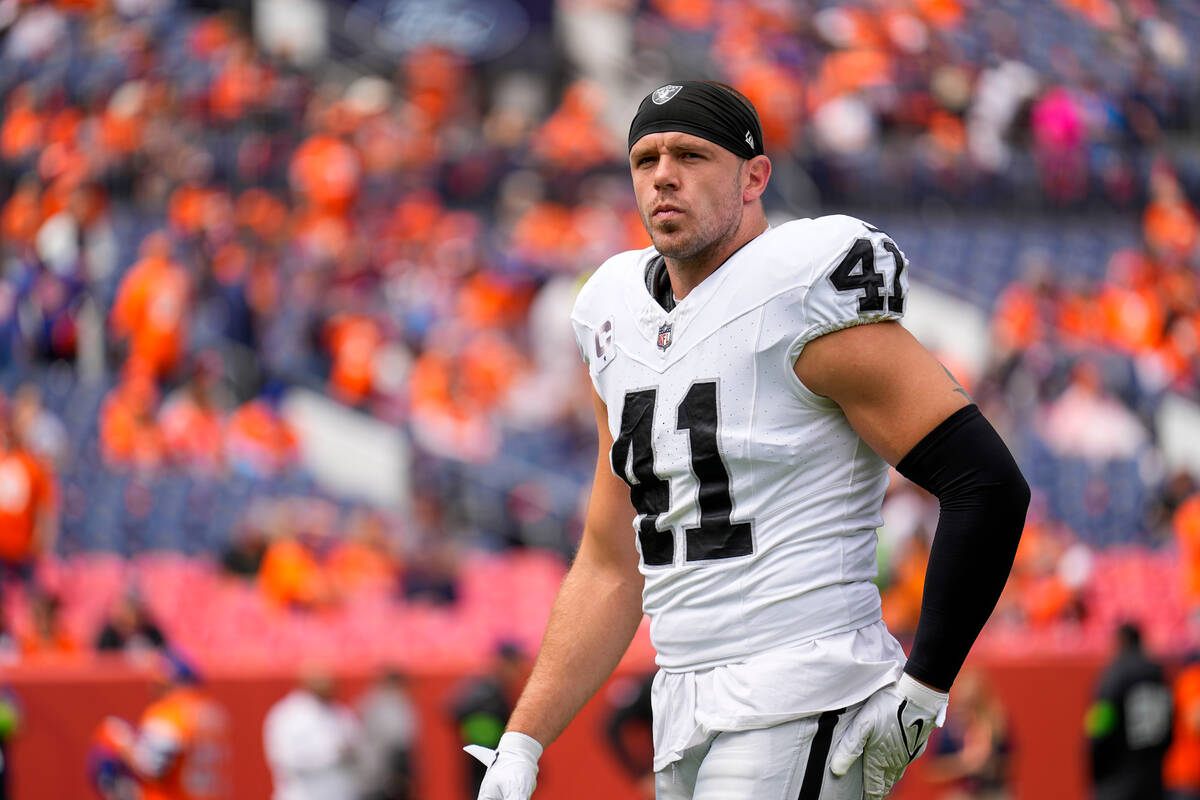 Las Vegas Raiders linebacker Robert Spillane looks on before an NFL football game against the D ...