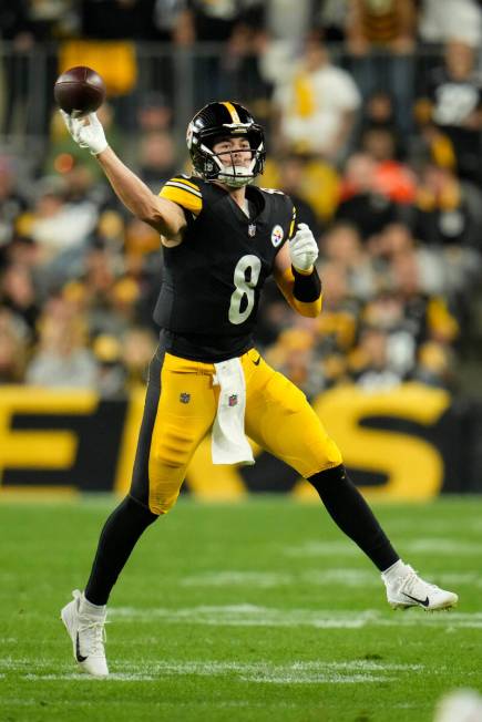 Pittsburgh Steelers quarterback Kenny Pickett (8) throws a pass during an NFL football game aga ...