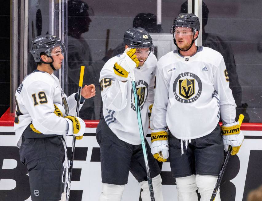 Golden Knights center Jack Eichel (9) talks with center Ivan Barbashev (49) and center Brendan ...