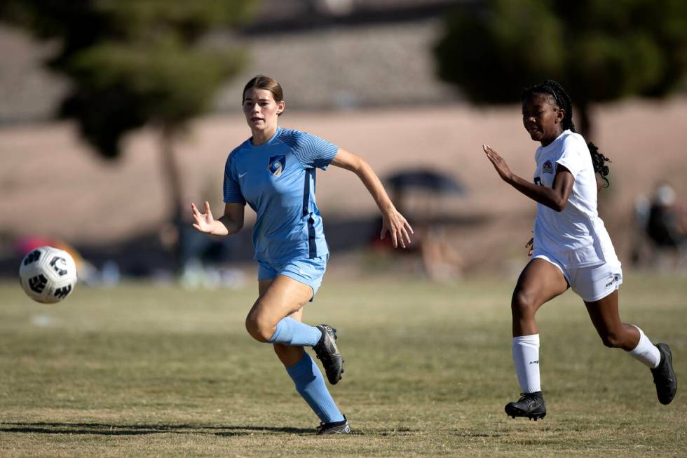 Foothill defender Alia Bindrup, left, races for the ball against Doral forward Sanyi Thompson d ...