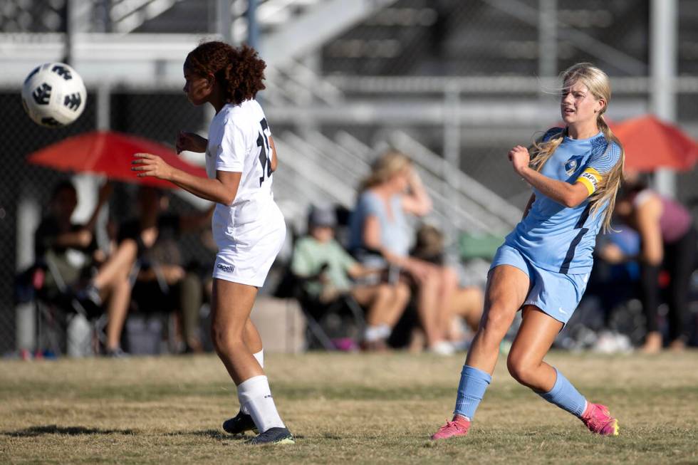 Foothill midfielder Tianna Hunsaker, right, attempts a goal over Doral during a girls high scho ...