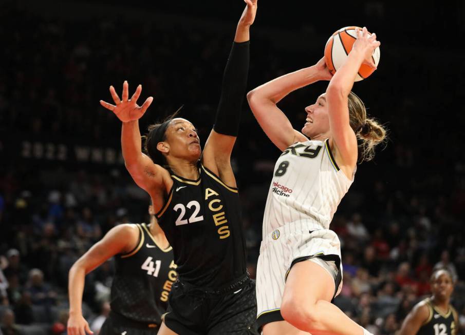 Aces center A’ja Wilson (22) blocks a Chicago Sky player from shooting during a game on ...