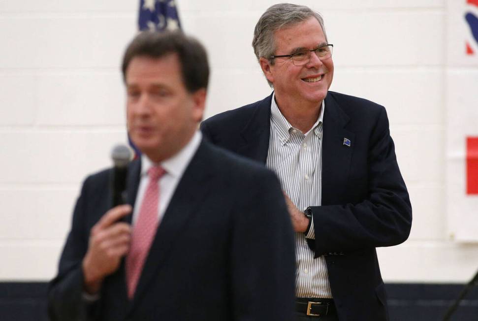 FILE - Former Lt. Gov. Brian Krolicki, left, introduces former Florida Gov. Jeb Bush during a t ...