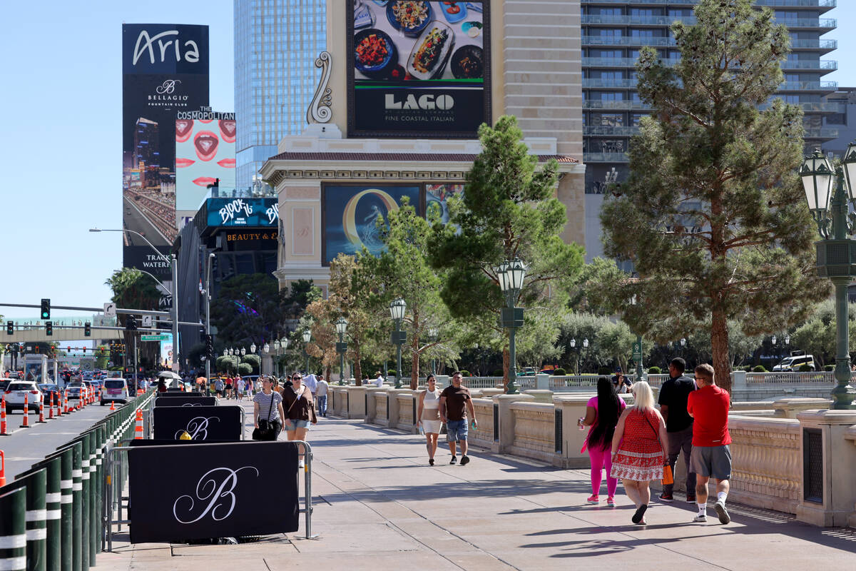 Barricades block off stumps from trees cut down in front of the Bellagio on the Strip in Las Ve ...