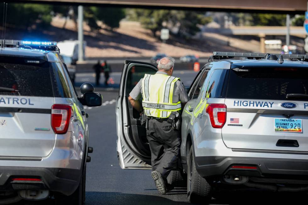 Investigators work the scene of a fatal pedestrian crash on northbound Interstate 15 south of L ...