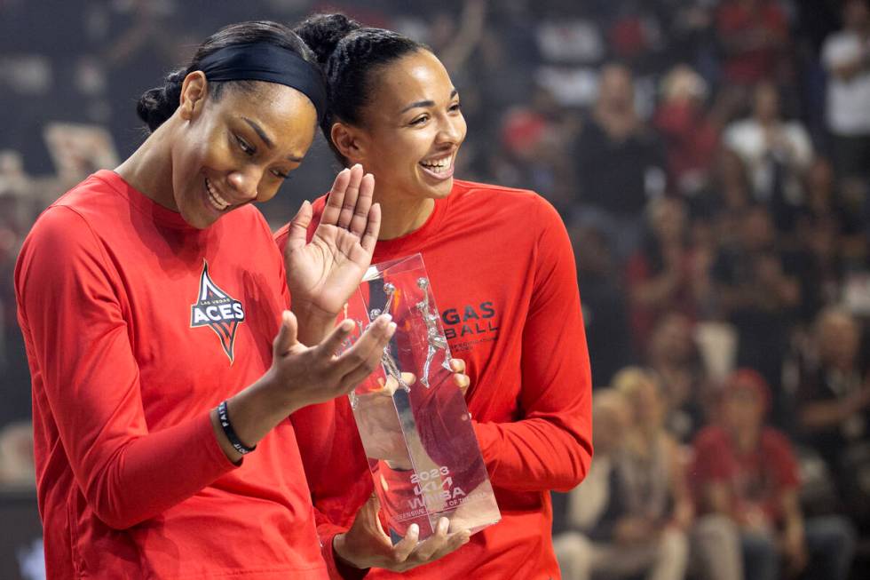 Las Vegas Aces forward A'ja Wilson accepts her award for WNBA Defensive Player of the Year alon ...