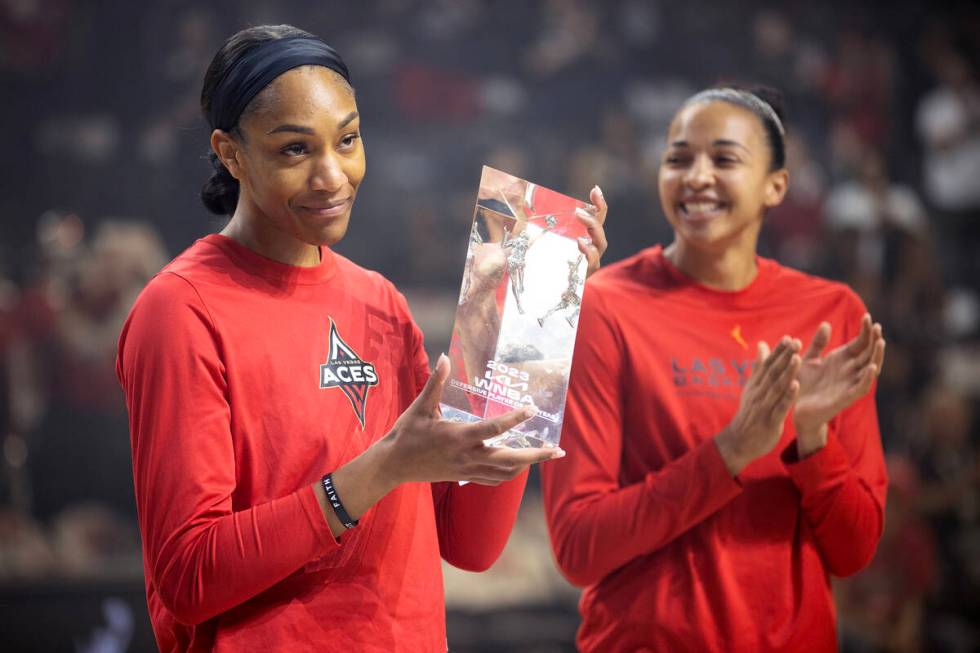 Las Vegas Aces forward A'ja Wilson accepts her award for WNBA Defensive Player of the Year alon ...