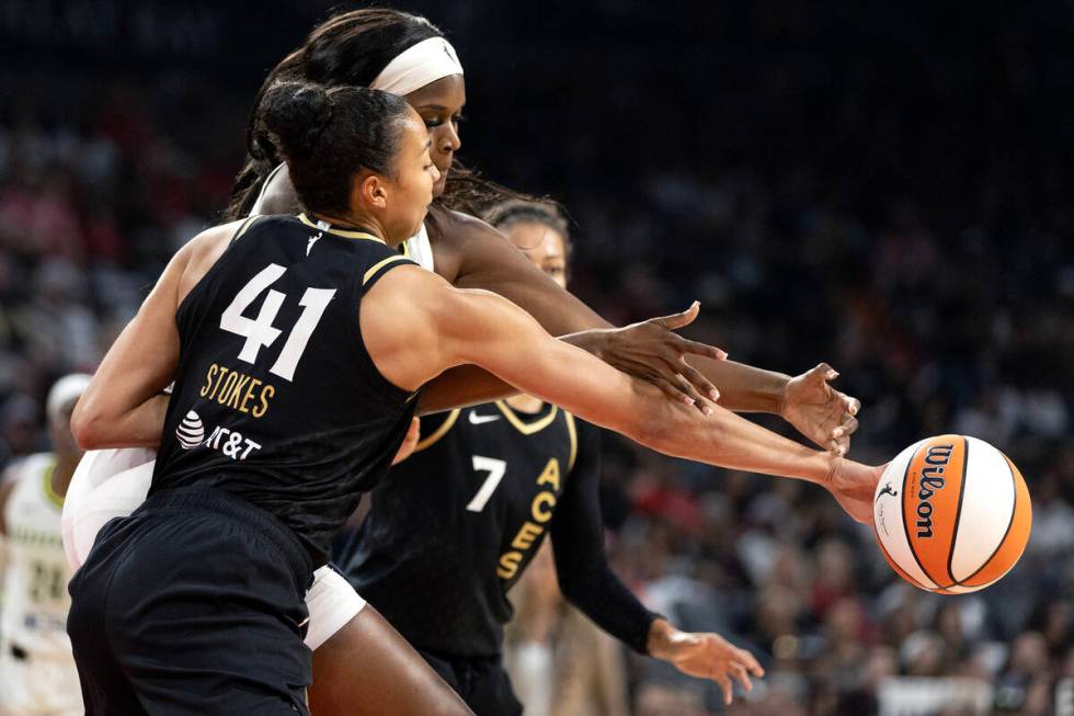 Las Vegas Aces center Kiah Stokes (41) steals the ball from Dallas Wings center Kalani Brown (2 ...