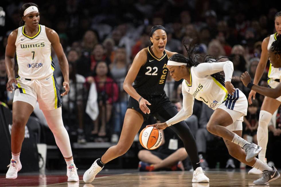 Dallas Wings guard Odyssey Sims (2) steals the ball from Las Vegas Aces forward A'ja Wilson (22 ...