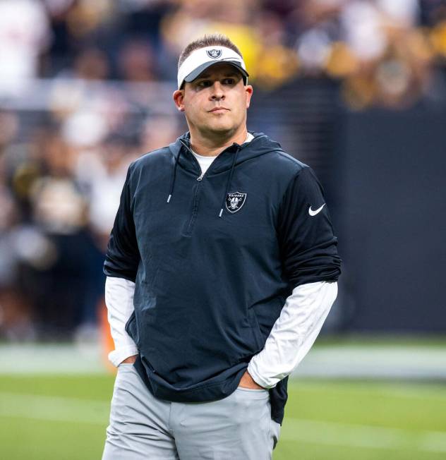 Raiders Head Coach Josh McDaniels looks to the stands during warm ups before the first half of ...