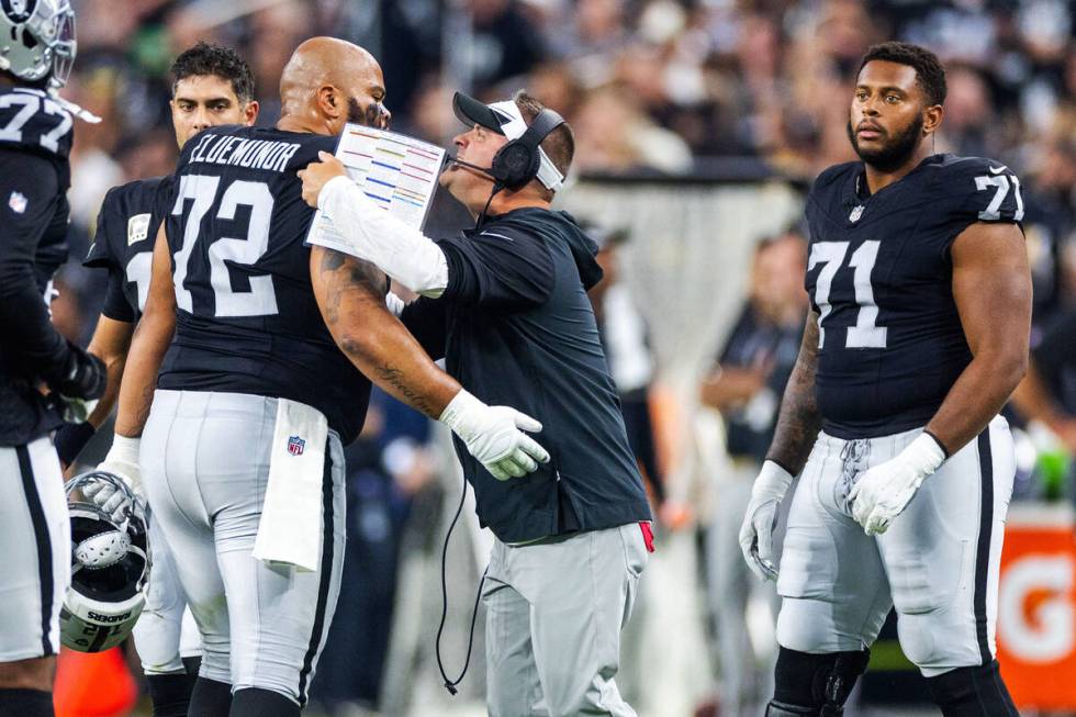 Raiders offensive tackle Jermaine Eluemunor (72) gets an earful from Raiders Head Coach Josh Mc ...