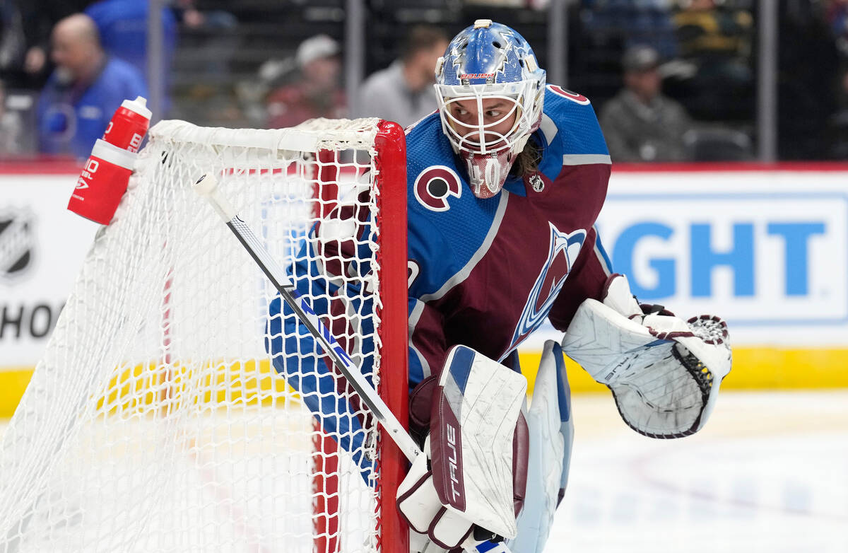 Colorado Avalanche goalie Alexandar Georgiev checks behind the net during play against the Vega ...