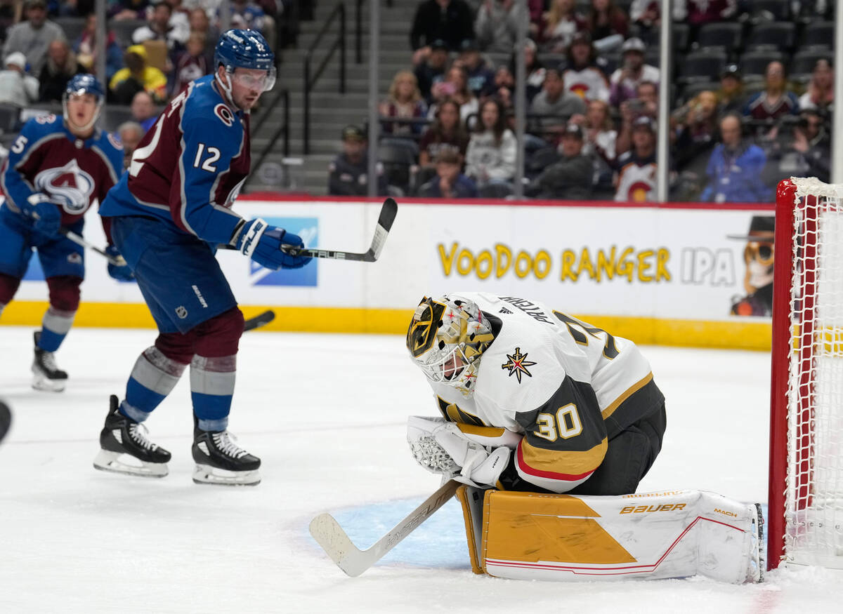 Vegas Golden Knights goalie Jiri Patera, right, stops a shot as Colorado Avalanche center Ryan ...