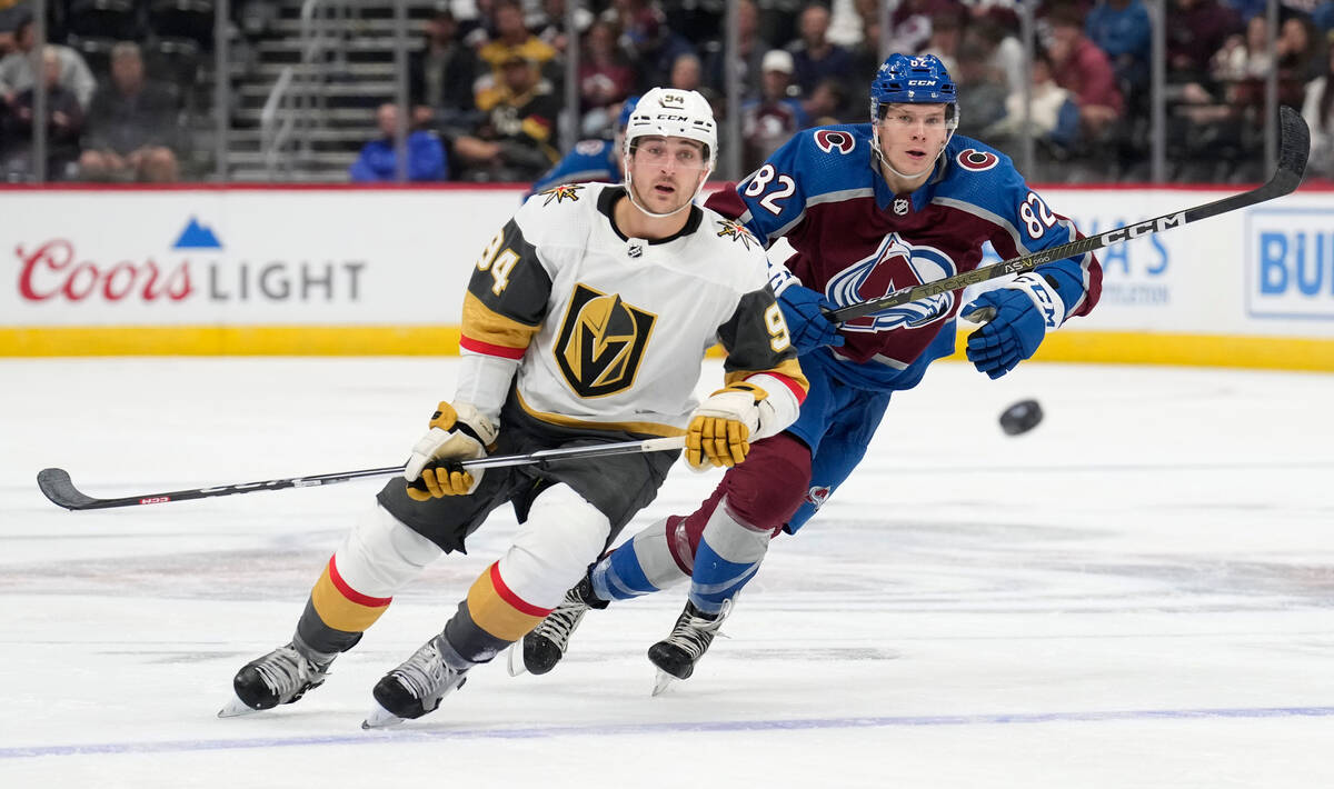 Vegas Golden Knights defenseman Brayden Pachal, left, pursues the puck with Colorado Avalanche ...