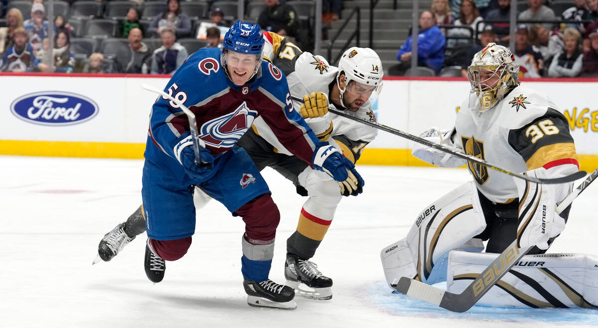 Colorado Avalanche center Ben Meyers, left, drives past Vegas Golden Knights defenseman Nicolas ...