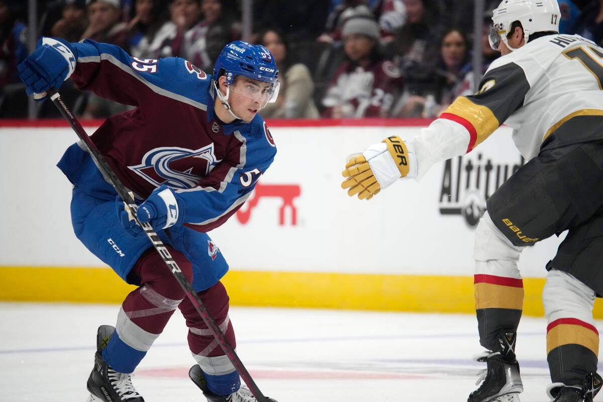 Colorado Avalanche center Maros Jedlicka, left, drives past Vegas Golden Knights defenseman Ben ...